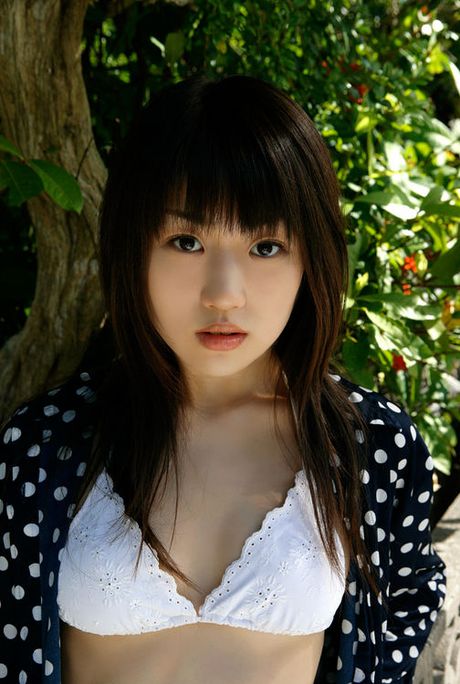 Cute gravure idol babe with perfect plump boobs in orange bikini