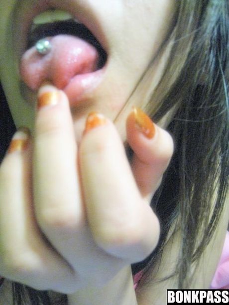 China teen girl in sexy pink colored polka dot bikini