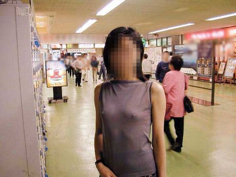 Asian lady strips and shows her curves in the public place