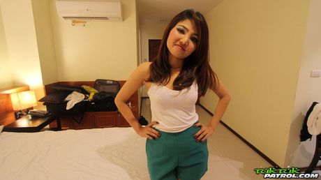 Asian babe Jar strips and shows her perfect butt and tits in a public pool