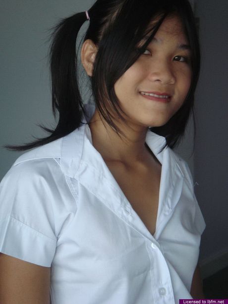 Asian schoolgirl with tiny tits strips off and unveils her pussy up close