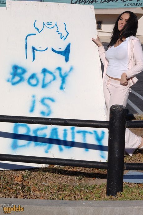 Asian teen Dee Lily strips and shows her amazing boobs and ass in the backyard