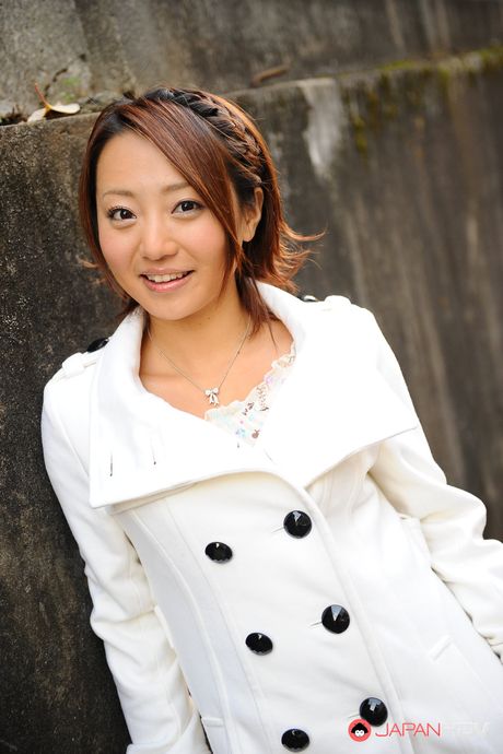 Handsome babe You Shiraishi poses outdoor in her white coat for camera