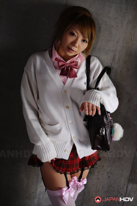 Cute school girl Rui Hazuki poses in her short uniform in parking lot