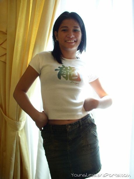 Amateur Asian girl with tiny tits strips and toys her pussy on the bed