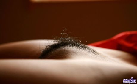 Platinum Asian Seiko Yamaguchi strips to her stockings & shows her hairy cunt