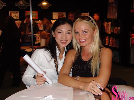 Asian MILF Sylvia Saint enjoys a hot threesome with two hung studs